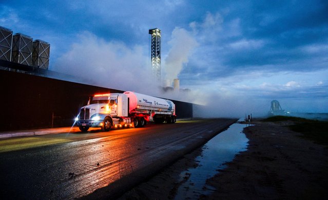 A fuel truck carrying liquid nitrogen passes by before sunrise as preparations to launch a SpaceX Starship spacecraft continue, in Starbase, Texas, U.S., on August 25, 2025. (Photo by Steve Nesius/Reuters)