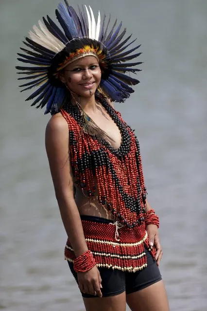 An indigenous woman from Terena tribe poses for photos after participating in a parade of indigenous beauty during the first World Games for Indigenous Peoples in Palmas, Brazil, October 29, 2015. (Photo by Ueslei Marcelino/Reuters)