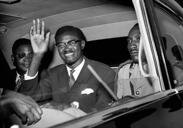 In this July 24, 1960 file photo, Congo Premier Patrice Lumumba waves as he sits in car for the drive from Idlewild Airport, New York after his arrival from Europe to speak to the United Nations Security Council. The family of Congolese independence icon Patrice Lumumba will soon receive the only known remains of the assassinated leader, a tooth removed after his death by a Belgium man whose family apparently held on to it for nearly 60 years, the federal prosecutor's office in Belgium announced on Thursday, Sept. 10, 2020. (Photo by AP Photo/File)