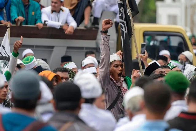 Supporters of an Indonesian hardline Muslim group gather to protest in Banda Aceh on April 19, 2018, against a new regulation that will see criminals flogged only behind prison walls. Indonesia' s Aceh province will stop whipping criminals in public after a wave of international condemnation of the practice, local officials said recently. Aceh is the only province in the world' s most populous Muslim- majority country that imposes sharia law and people can be flogged for a range of offences – from gambling, to drinking alcohol to having gay s*x or relations outside of marriage. (Photo by Chaideer Mahyuddin/AFP Photo)