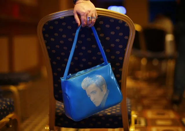 A woman holds a Elvis bag during the annual European Elvis Tribute Artist Contest and Convention in Birmingham, central England January 2, 2015. (Photo by Darren Staples/Reuters)