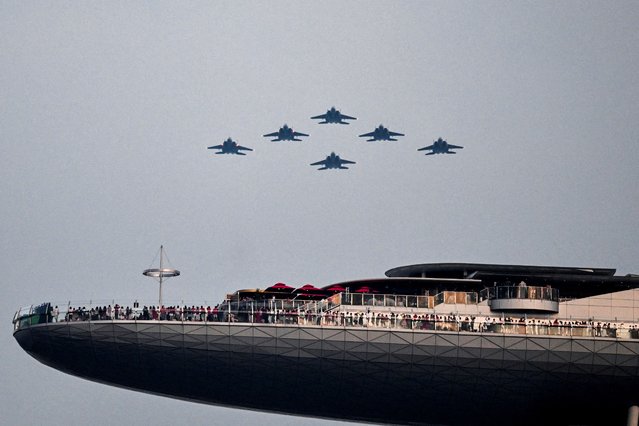 The aerial flypast is performed by the Singapore Armed Forces at the 60th National Day Parade in Singapore on August 9, 2025. (Photo by Caroline Chia/Reuters)