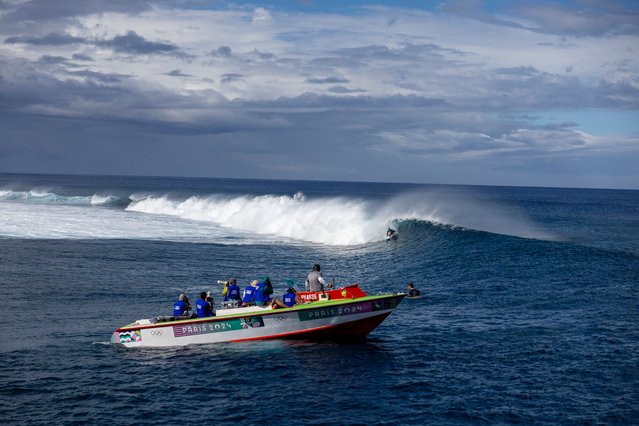 Candelaria Resano of Team Nicaragua rides a wave as photographers take photos during round two of surfing on day two of the Olympic Games Paris 2024 on July 28, 2024 in Teahupo'o, French Polynesia. (Photo by Ed Sloane/Getty Images)