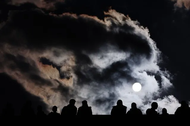A silhouette of 1. FC Nürnberg fans prior to the DFB Cup Quarterfinal match between 1. FC Nürnberg and VfB Stuttgart at Max-Morlock-Stadion on April 05, 2023 in Nuremberg, Germany. (Photo by Alexander Hassenstein/Getty Images)