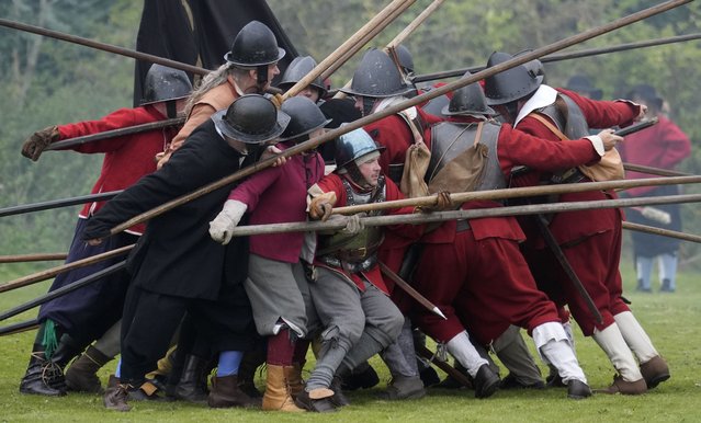 Members of the English Civil War re-enactment group, The Marquess of Winchester's Regiment, take part in a “skirmish” during the English Civil War re-enactment weekend at Basing House in Basingstoke, Hampshire, UK on Sunday, September 15, 2024. (Photo by Andrew Matthews/PA Images via Getty Images)