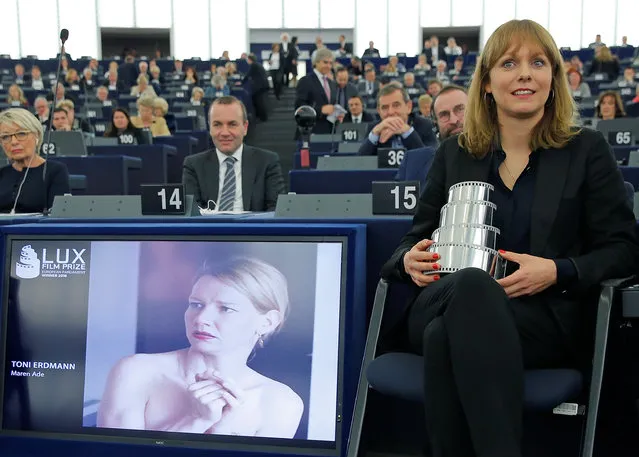 Germany's Director Maren Ade delivers sits with her trophy after she was awarded with the Lux cinema prize of the European Parliament for her film “Toni Erdmann” during a ceremony at the European Parliament in Strasbourg France, November 23, 2016. (Photo by Vincent Kessler/Reuters)