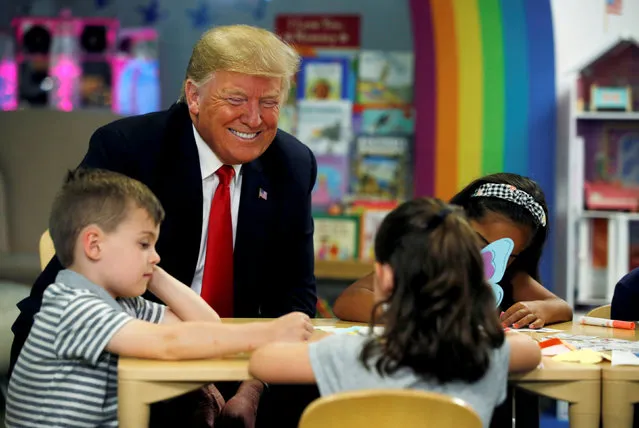 U.S. President Donald Trump speaks with children while visiting Nationwide Children's Hospital in Columbus, Ohio, U.S., August 24, 2018. (Photo by Leah Millis/Reuters)