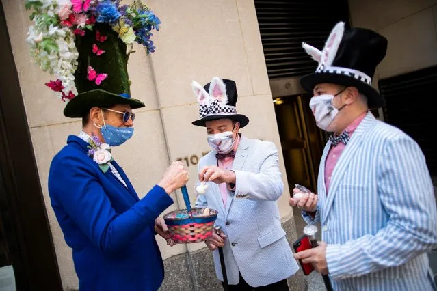 People wearing costumes attend the annual Easter Parade and Bonnet Festival on Fifth Avenue, amid the coronavirus disease (COVID-19) pandemic, in New York City, U.S., April 4, 2021. (Photo by Eduardo Munoz/Reuters)