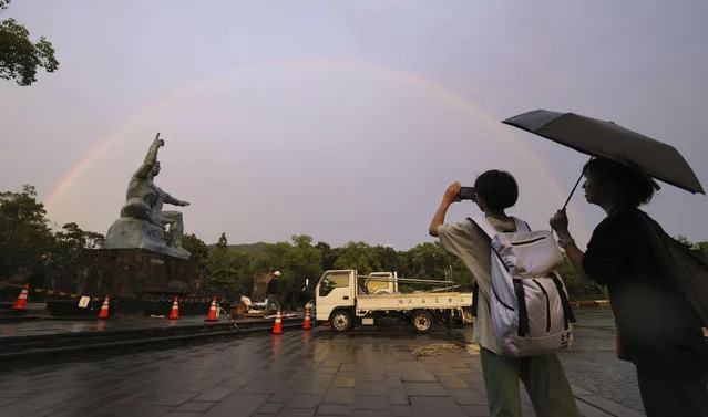 A rainbow appears in the sky over Peace Park in Nagasaki, Japan, Tuesday, August 8, 2023, a day before the 78th anniversary of the U.S. atomic bombing of the southwestern Japan city. Early Tuesday morning, the storm was centered 350 kilometers (217 miles) south of Kagoshima, a city on the southwestern tip of Japan's main southern island of Kyushu and south of Nagasaki. Khanun produced winds of 108 kph (67 mph) with gusts to 144 kph (89 mph) and was slowly moving north, the Japan Meteorological Agency reported. (Photo by Kyodo News via AP Photo)