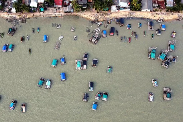 An aerial view shows wooden pontoons along the shore of Toboali, on the southern shores of the island of Bangka, Indonesia, April 29, 2021. Picture taken with a drone. (Photo by Willy Kurniawan/Reuters)
