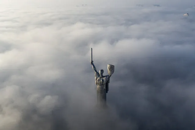 The aerial photo of the WWII memorial taken through morning fog during sunrise in Ukraine's capital Kiev, Ukraine, Saturday, November 10, 2018. (Photo by Evgeniy Maloletka/AP Photo)