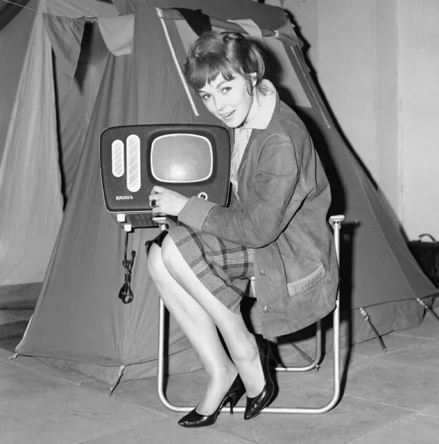 Small portable television receiver with a 110-degree wide angle 9½-inch screen at a camping exhibition in Hamburg, Germany, March 3, 1960. The receiver is powered by an automobile battery. It costs 165 dollars and is made by Kaiser-Werke, Kenttingen/Breisgau of West Germany. (Photo by Peter Hillebrecht/AP Photo)