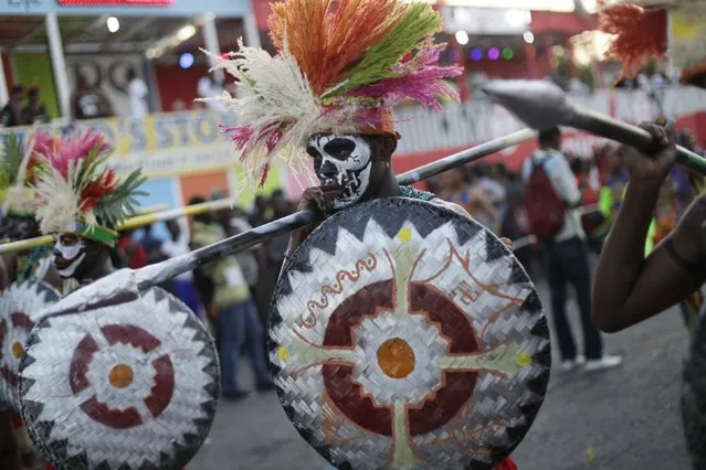 Revellers take part in the Carnival 2016 parade in Port-au-Prince, Haiti, February 8, 2016. Carnival celebrations on Sunday were canceled due to the eruption of violent anti-government protests. (Photo by Andres Martinez Casares/Reuters)