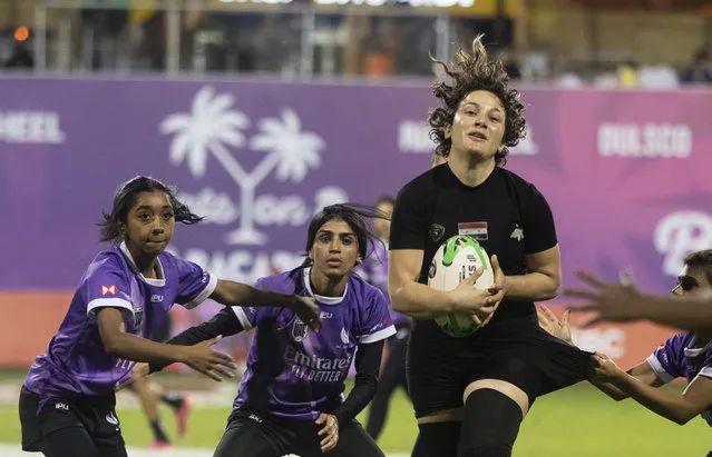 A player for Syria's Al Arabi catches the ball during the match against Emirati side Al Maha during the first all-Arab women's match at the Emirates Dubai Rugby Sevens on December 1, 2023. (Photo by Ruel Pableo for The National)