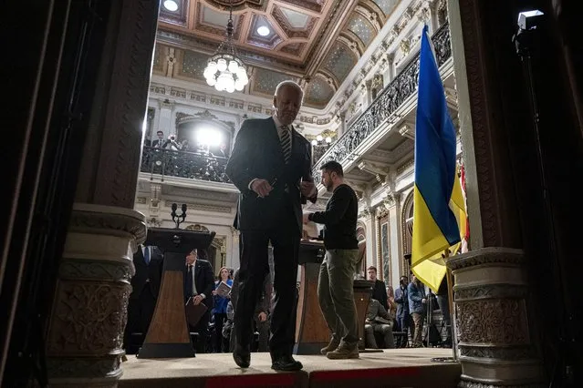 President Joe Biden and Ukrainian President Volodymyr Zelenskyy depart a news conference in the Indian Treaty Room in the Eisenhower Executive Office Building on the White House Campus, Tuesday, December 12, 2023, in Washington. (Photo by Andrew Harnik/AP Photo)