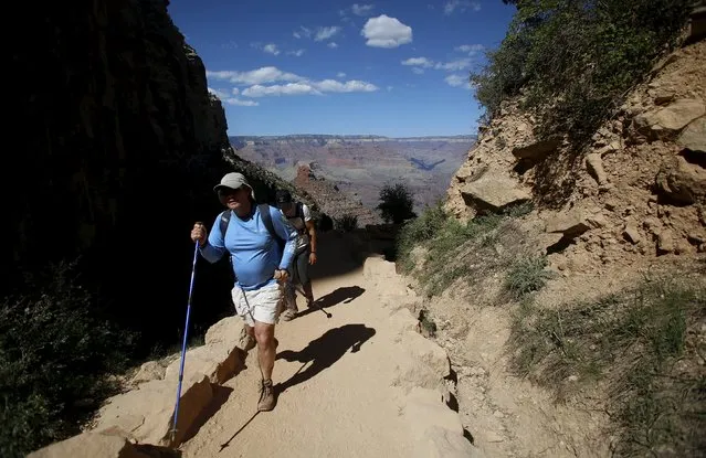 Hikers make their way along a trail in Grand Canyon National Park in northern Arizona, April 12, 2015. (Photo by Jim Urquhart/Reuters)
