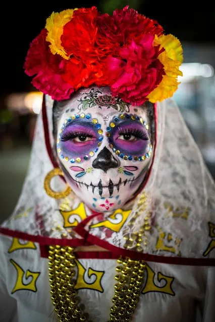 Day of the Dead, Cancun, Mexico. Category: People. A woman dressed in skull-candy face paint and costume to celebrate the Day of the Dead festival in Cancun’s El Parque De Las Palapas. (Photo by Laura Jane Dale/National Geographic Traveller UK)