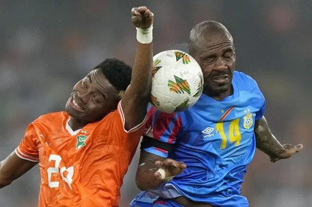DR Congo's Gael Kakuta, right, battles for the ball with Ivory Coast's Simon Adingra during the African Cup of Nations semifinal soccer match between Ivory Coast and DR Congo, at the Olympic Stadium of Ebimpe in Abidjan, Ivory Coast, Wednesday, February 7, 2024. (Photo by Sunday Alamba/AP Photo)