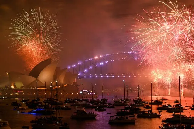 Fireworks explode over Sydney Harbour during the New Year's Eve celebrations in Sydney, Australia on January 1, 2023. (Photo by Jaimi Joy/Reuters)
