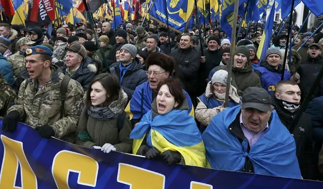 Activists of nationalist groups and their supporters take part in the so-called March of Dignity, marking the third anniversary of the 2014 Ukrainian pro-European Union (EU) mass protests, in Kiev, Ukraine, February 22, 2017. (Photo by Valentyn Ogirenko/Reuters)