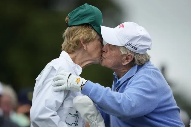 Honorary starter Jack Nicklaus kisses his wife Barbara after the ceremonial tee shot on the first hole during the first round at the Masters golf tournament at Augusta National Golf Club Thursday, April 11, 2024, in Augusta, Ga. (Photo by Matt Slocum/AP Photo)