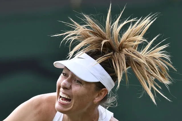 Russia's Maria Sharapova serves against France's Pauline Parmentier during their women's singles first round match on the second day of the 2019 Wimbledon Championships at The All England Lawn Tennis Club in Wimbledon, southwest London, on July 2, 2019. (Photo by Ben Stansall/AFP Photo)