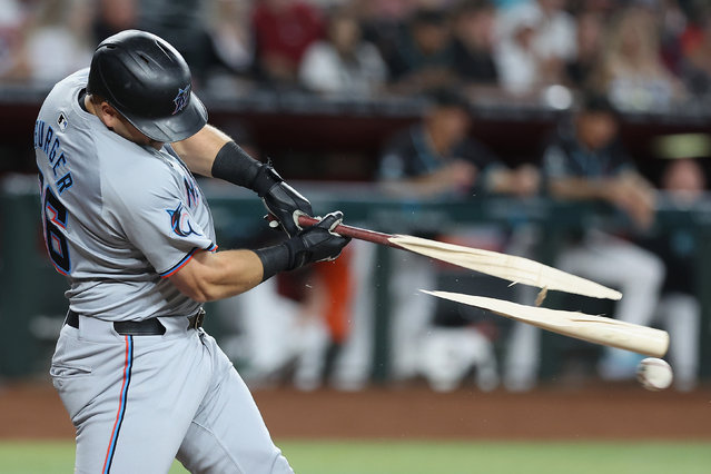 Jake Burger #36 of the Miami Marlins breaks his bat while hitting against the Arizona Diamondbacks during the second inning of the MLB game at Chase Field on May 26, 2024 in Phoenix, Arizona. (Photo by Christian Petersen/Getty Images)
