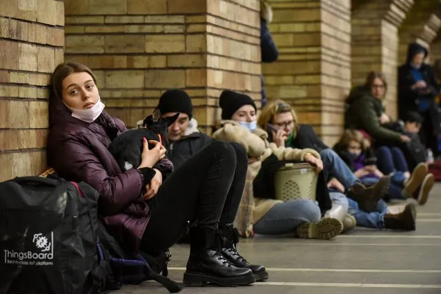 Ukrainians take shelter in a metro station after air raid sirens alarm in Kiev, Ukraine, 24 February 2022. Russian troops launched a major military operation on Ukraine on 24 February, after weeks of intense diplomacy and the imposition of Western sanctions on Russia aimed at preventing an armed conflict in Ukraine. Martial law has been introduced in Ukraine, explosions are heard in many cities, including Kiev. (Photo by EPA/EFE/Stringer)