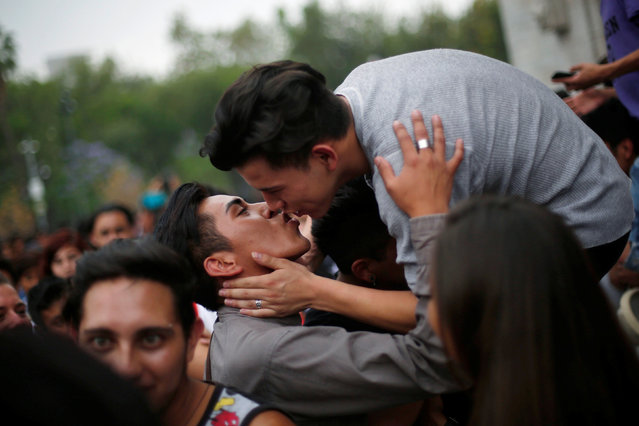 Members of the LGBT community kiss during a Kissathon to celebrate International Day Against Homophobia, outside Bellas Artes museum in Mexico City, Mexico, May 17, 2016. (Photo by Edgard Garrido/Reuters)