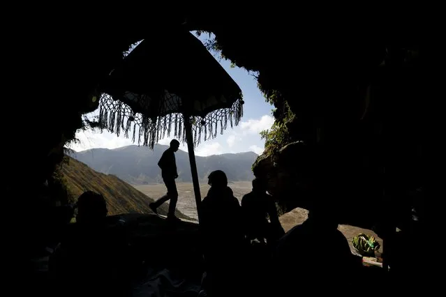 Hindu villagers pray inside a cave ahead of the annual Kasada festival at Mount Bromo in Indonesia's East Java province, July 30, 2015. (Photo by Reuters/Beawiharta)