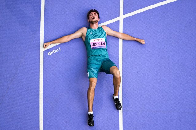 An overview shows Neutral Paralympic Athletes (NPA) Andrei Vdovin celebrating after winning the men's 400m T37 final, during the Paris 2024 Paralympic Games at the Stade de France, in Saint-Denis, outside Paris, on September 4, 2024. (Photo by François-Xavier Marit/AFP Photo)