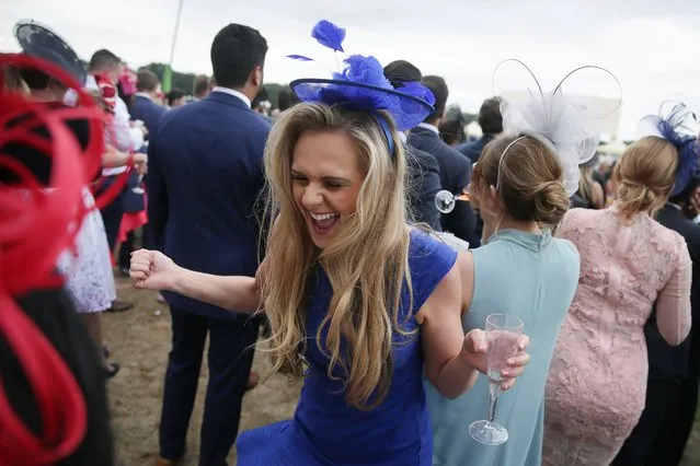Race-goers celebrate after the Gold Cup on Ladies Day at Royal Ascot near London, Britain, 22 June 2017. Royal Ascot runs until 24 June. (Photo by Tim Ireland/EPA)