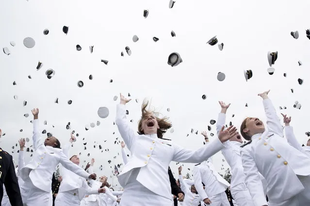 United States Naval Academy graduates celebrate and throw their hats at the end of the academy's graduation and commission ceremony, at the Navy-Marine Corps Memorial Stadium in Annapolis, Maryland, USA, 27 May 2022. There are 1,100 graduates in the Naval Academy class of 2022. (Photo by Michael Reynolds/EPA/EFE)