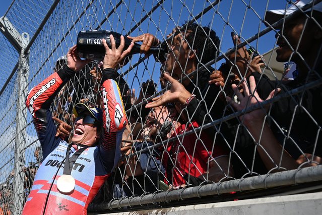 Third-placed Gresini Racing MotoGP's Spanish rider Marc Marquez celebrates following the MotoGP sprint race of the Indonesian Grand Prix at the Mandalika International Circuit in Mandalika, West Nusa Tenggara on September 28, 2024. (Photo by Sonny Tumbelaka/AFP Photo)