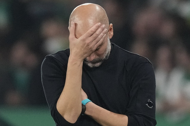 Manchester City's head coach Pep Guardiola reacts during the UEFA Champions League opening phase soccer match between Sporting and Manchester City in Lisbon, Portugal, Tuesday, November 5, 2024. (Photo by Armando Franca/AP Photo)