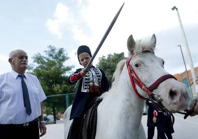 Alkar Vito poses for a picture on a horse before the Children's Alka competition in Vuckovici village, Croatia, August 23, 2015. (Photo by Antonio Bronic/Reuters)