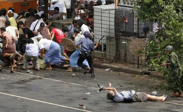 Reuters won the Pulitzer Prize for breaking news photography for a picture of a Japanese videographer killed during a demonstration in Myanmar. (Photo by Adrees Latif/Reuters)