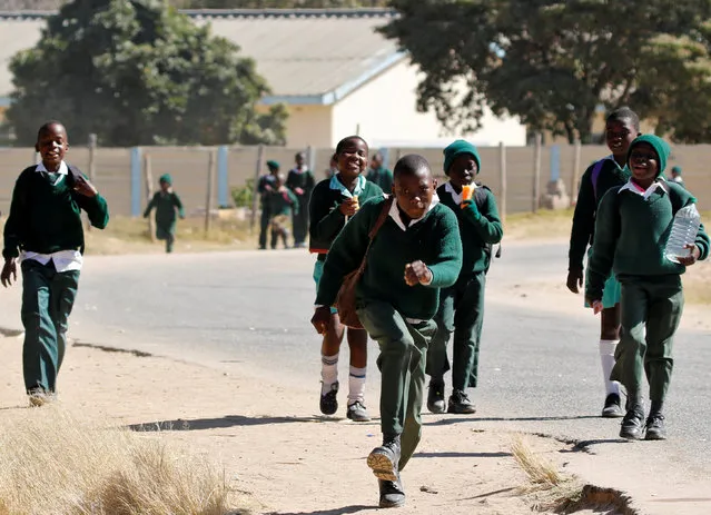 School pupils walk home from school in Epworth near Harare, Zimbabwe, July 5, 2016. (Photo by Philimon Bulawayo/Reuters)