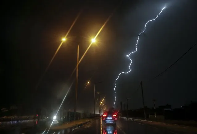 Lightning lights up the sky over central Gaza strip during a storm in Gaza Strip, 20 November 2021. (Photo by Mohammed Saber/EPA/EFE)