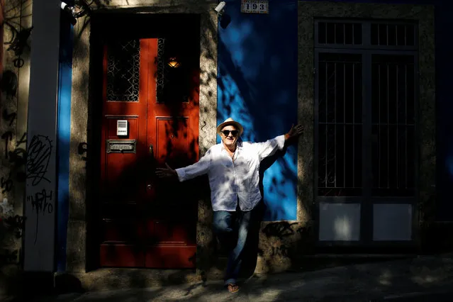 Jorge Salomao, a 70-year-old poet, poses for a portrait outside a bar in Rio de Janeiro, Brazil, July 15, 2016. When asked what he felt about Rio de Janeiro hosting the Olympics, Jorge said, “We are going through so many difficult times that the Olympics will bring a moment of joy and fraternization in this city that is the most beautiful in the world”. (Photo by Pilar Olivares/Reuters)