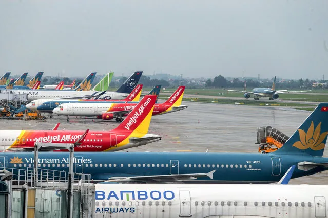 General view of planes of the Vietnam Airlines, Vietjet Air, and Bamboo Airways grounded at Noi Bai International airport in Hanoi, Vietnam, 24 April 2020. The Ministry of Transport has recently allowed to reopen some domestic flights, as well as increasing the flight frequency between Hanoi and Ho Chi Minh City amid the ongoing coronavirus COVID-19 pandemic. (Photo by Minh Hoang/EPA/EFE/Rex Features/Shutterstock)
