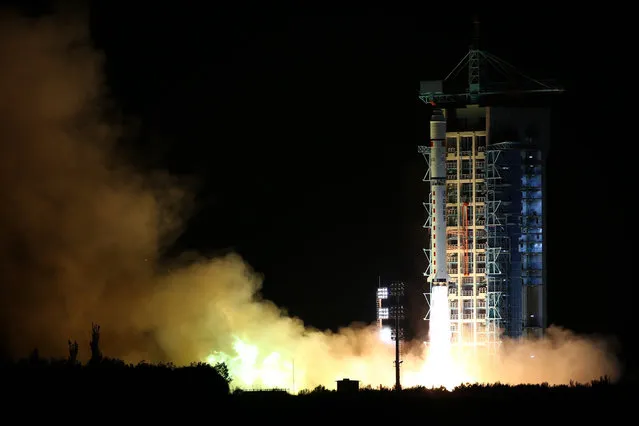 In this photo released by China's Xinhua News Agency, a Long March-2D rocket carrying the world's first quantum satellite lifts off from the Jiuquan Satellite Launch Center in Jiuquan, northwestern China's Gansu Province, early Tuesday, August 16, 2016. Experts say China's launch of the first quantum satellite will push forward the worldwide effort to develop the ability to send communications that are impenetrable by hackers. (Photo by Jin Liwang/Xinhua via AP Photo)