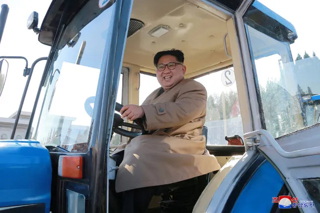 North Korean leader Kim Jong Un gives field guidance to the Kumsong Tractor Factory in this undated picture provided by KCNA in Pyongyang on November 15, 2017. (Photo by Reuters/KCNA)