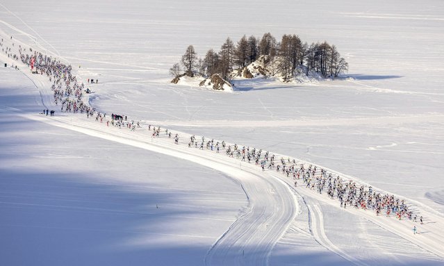 The pack of skiers is on its way during the 55. annual Engadin skiing marathon from Maloja to S-Chanf, Sunday, March 9, 2025, in Maloja, Switzerland. (Phoot by Peter Klaunzer/KEYSTONE)