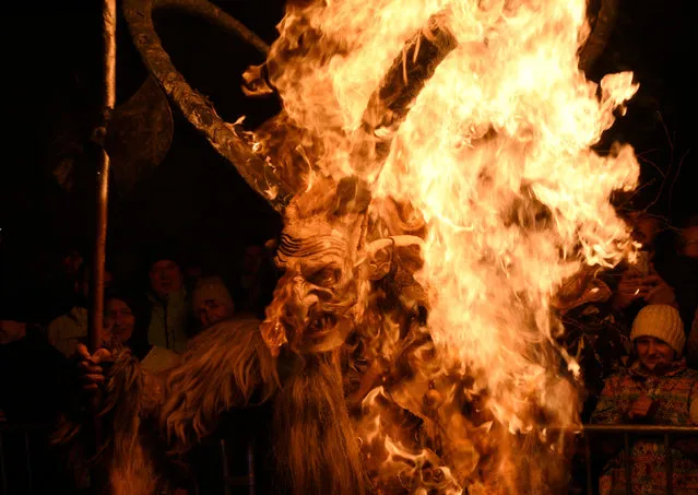 A man dressed as a devil performs during a Krampus show in Goricane, Slovenia, November 18, 2017. (Photo by Borut Zivulovic/Reuters)