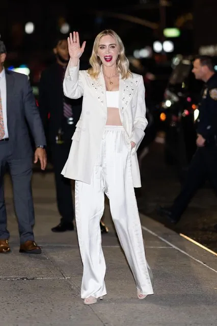 Emily Blunt is all smiles while stepping out in New York City on November 10, 2022. The 39 year old actress wore a white blazer, matching crop top, white trousers, and heels. (Photo by The Image Direct)
