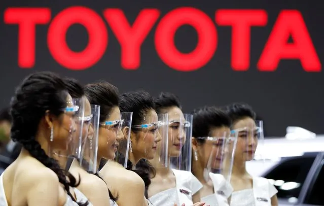 Promoters work during the 41st Bangkok International Motor Show in Bangkok, Thailand, July 15, 2020. Thailand opened its twice-postponed annual auto show to the public in the country's first large-scale event since coronavirus restrictions eased, with nearly all attendees wearing masks and face shields. (Photo by Jorge Silva/Reuters)
