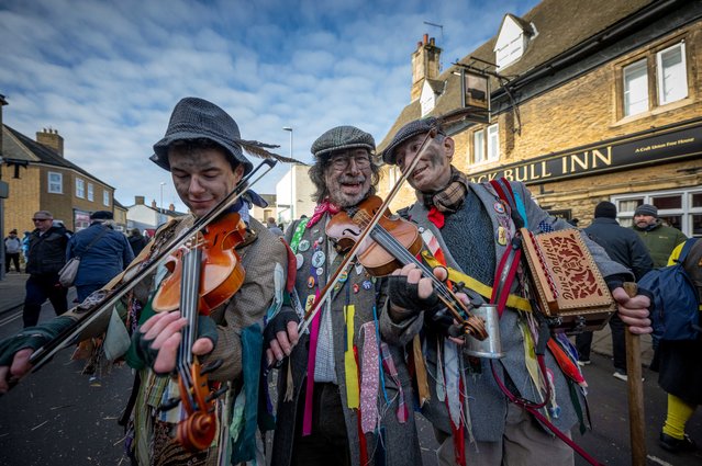 Bows at the ready for the Straw Bear festival in the Cambridgeshire town of Whittelsey, United Kingdom on January 13, 2024. The event, which dates back to the 19th century, features a person known as the “driver”, who is dressed in a suit of straw and parades around the town accompanied by musicians and colourful dancers. (Photo by South West News Service)