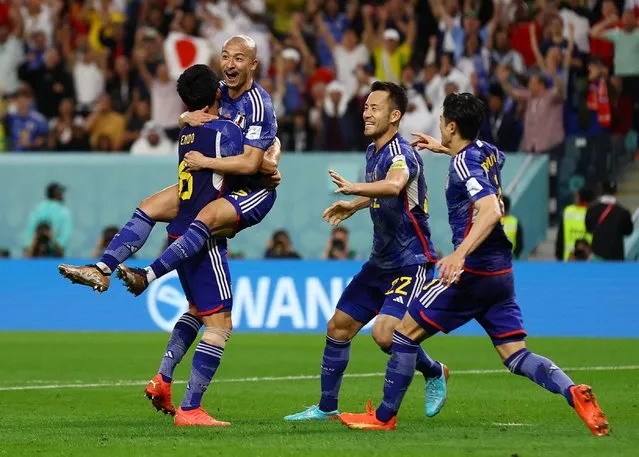 Daizen Maeda #25 of Japan celebrates with teammates after scoring his goal during the FIFA World Cup Qatar 2022 Round of 16 match between Japan and Croatia at Al Janoub Stadium on December 5, 2022 in Al Wakrah, Qatar. (Photo by Matthew Childs/Reuters)