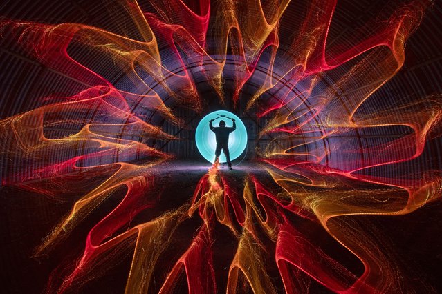 The photographer Kevin Jay and artist Nigel Cox rotate the camera and use coloured LEDs to paint with light in a building near Alresford in Essex, UK on April 19, 2025. (Photo by Kevin Jay/Picture Exclusive)